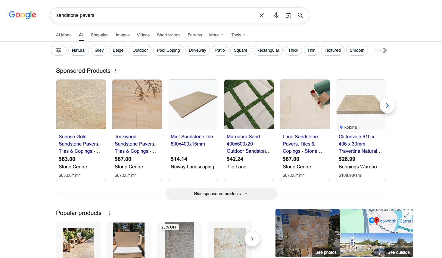 Google search results for 'sandstone pavers' showing sponsored Shopping listings filling the entire visible page