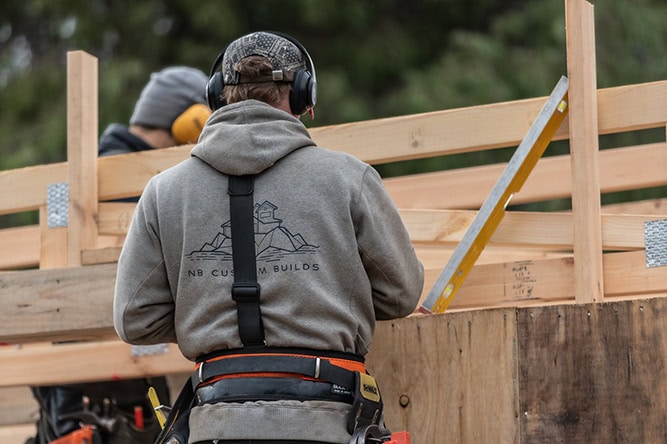 NB Custom Builds crew framing a roof on site