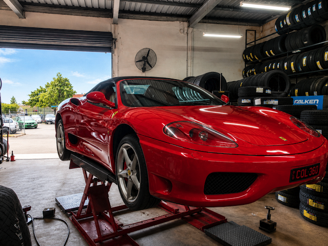 A Ferrari on the hoist at Retyre Kunda Park